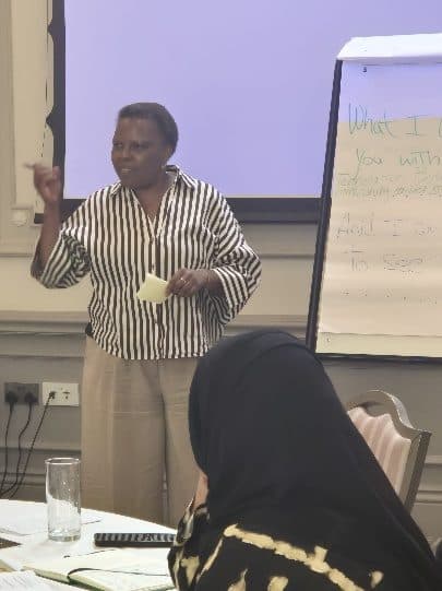 Marcia Daigo at the flipchart during an ADI gathering