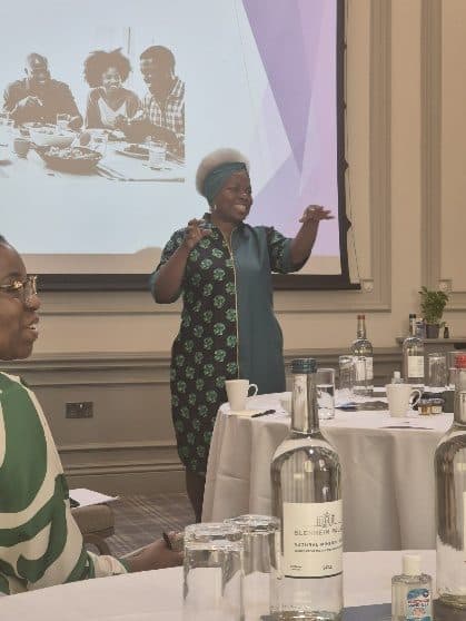 Pam Rowe speaking to the room at an ADI gathering